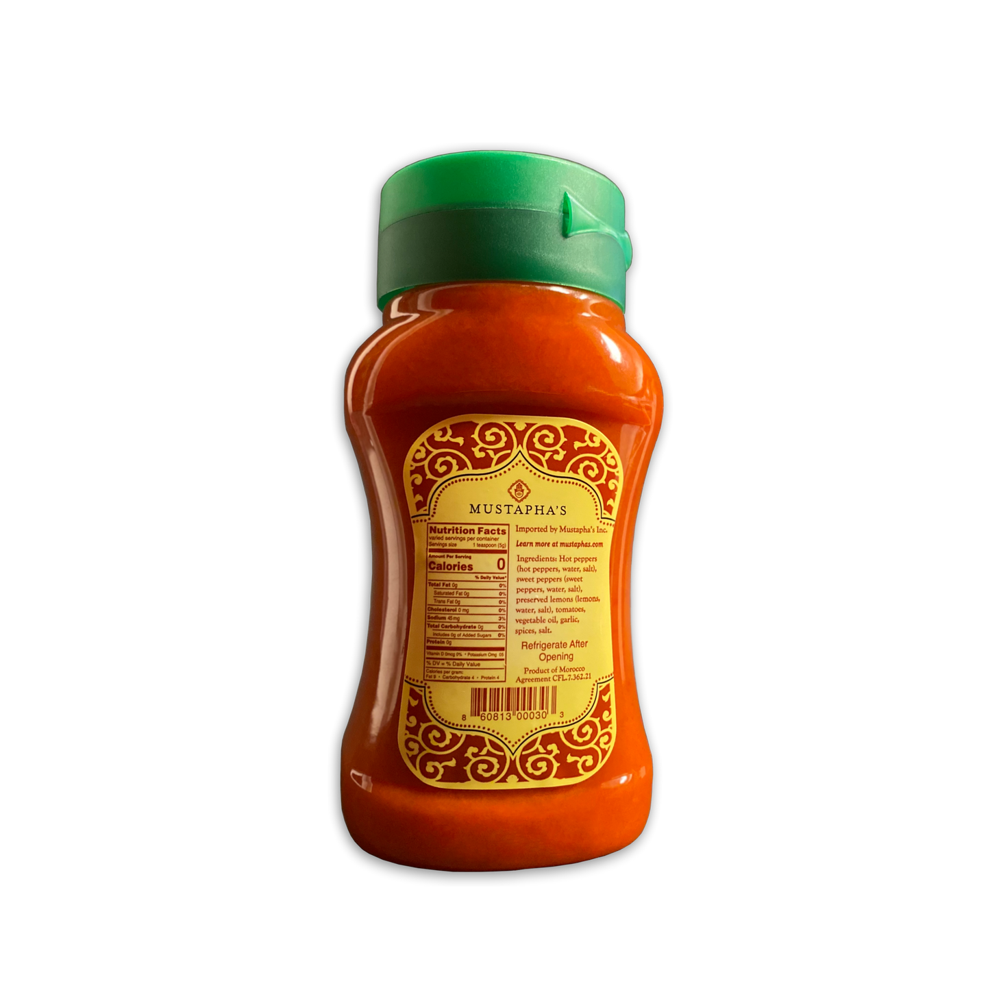Photo of Mustaphas Harissa Hot Sauce back label, featuring nutritional facts, and the ingredients. No preservatives, No additives, No binders, No fillers, No GMO's, No gluten, Sugars, Vegan, Paleo, Keto (Nutritional Info small bottle eleven ounces point sixty four)