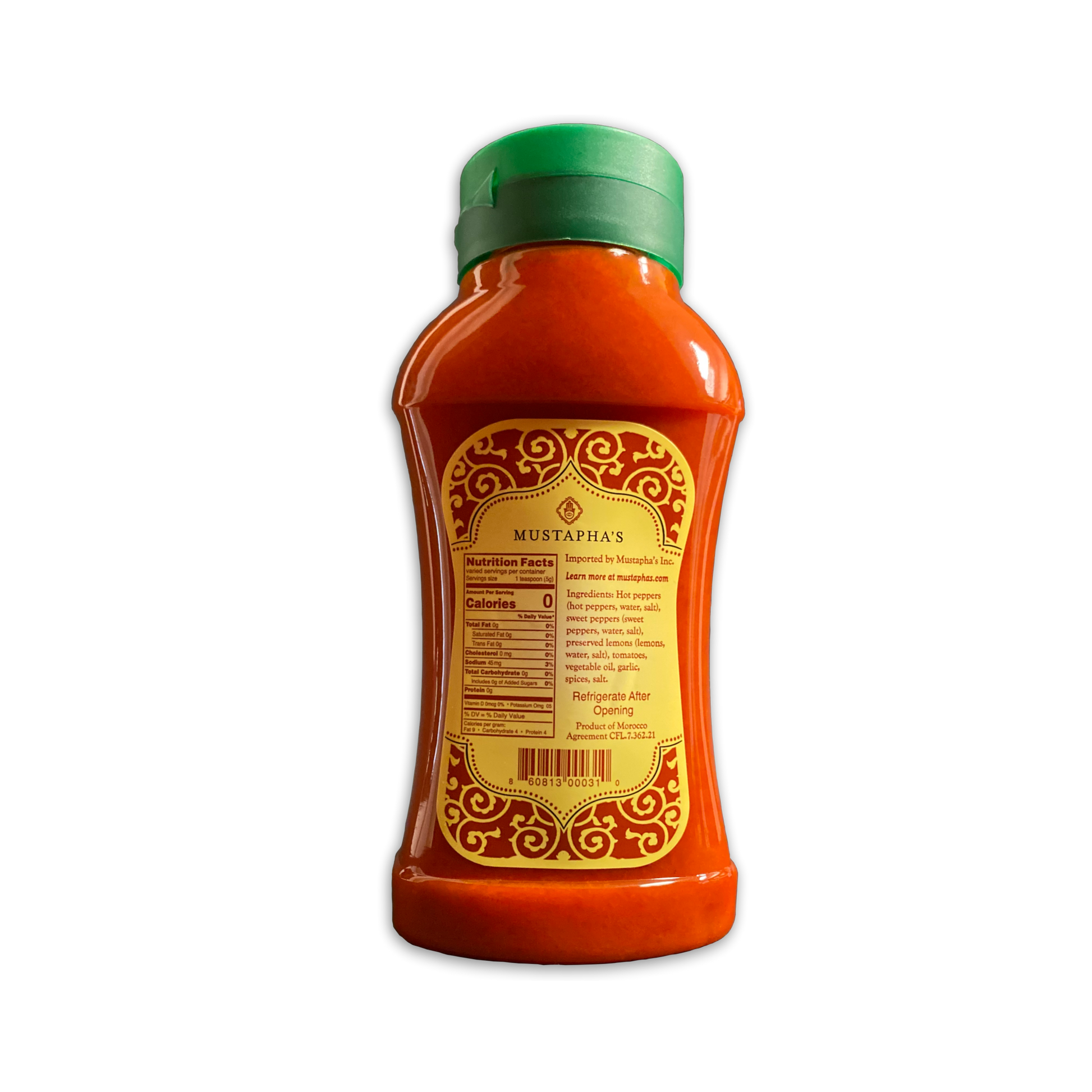 Photo of the back label of Mustapha’s Harissa Hot Sauce, showcased in a convenient 18.34 oz squeeze bottle. The label features a detailed nutritional table, ingredient list, and contact information. This user-friendly bottle makes it easy to add just the right amount of heat to your favorite dishes.